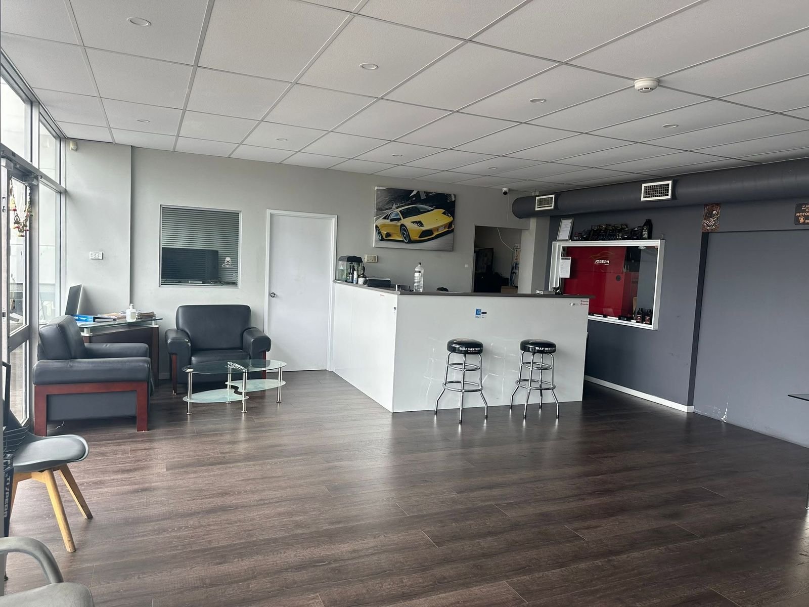 Reception counter and waiting area with leather armchairs